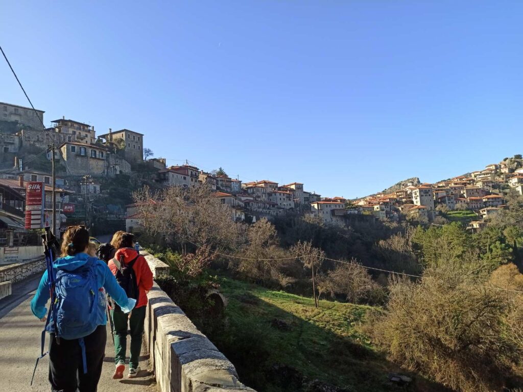 Menalon trail 6 Peloponnese arriving Dimitsana village with hikers.