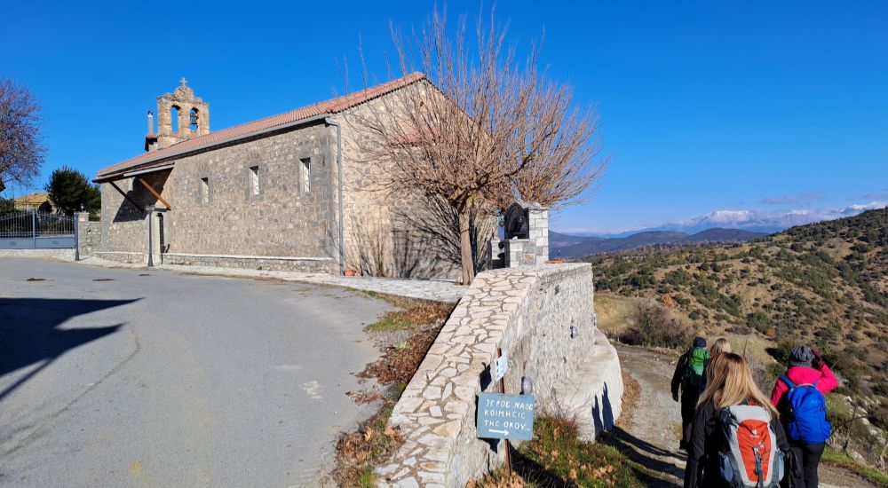 Menalon Trail 5, hikers walking by a church