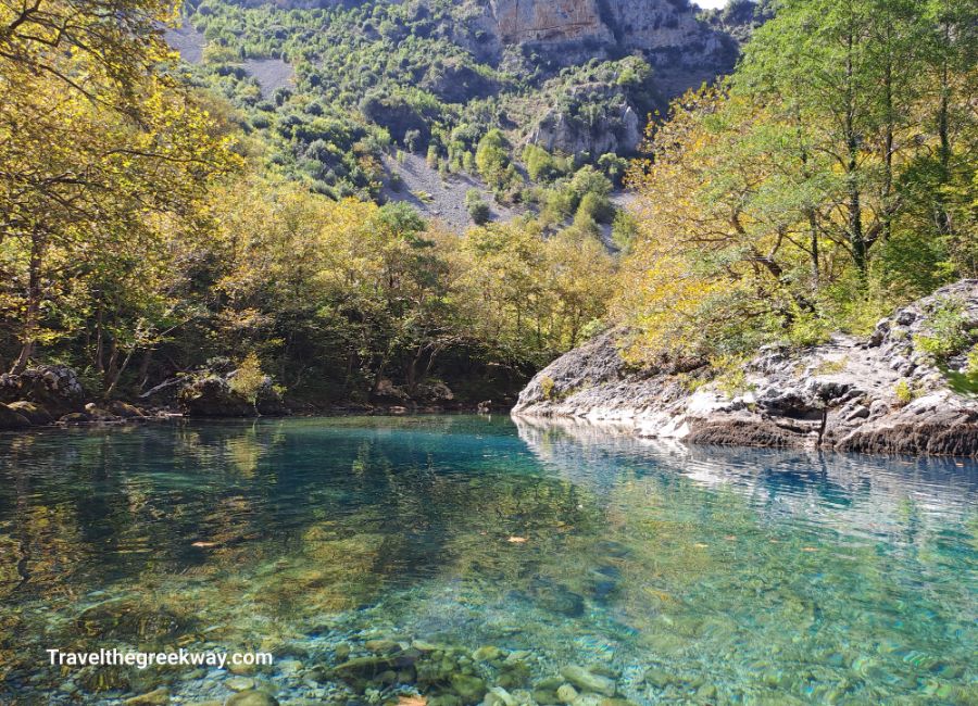 Tranquil emerald ponds of the Voidomatis nestled along the hiking trail in Vikos Gorge.