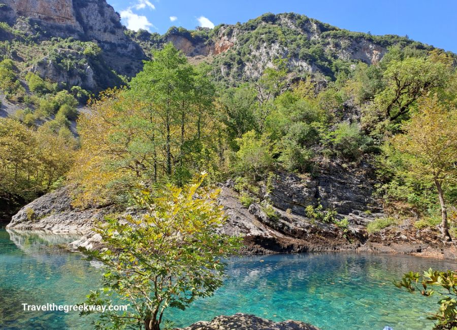 Tranquil emerald ponds of the Voidomatis nestled along the hiking trail in Vikos Gorge.