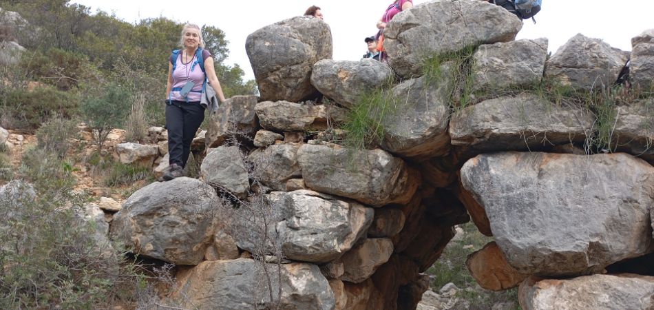 Evgenia on top of a Mycenaean bridge in the Peloponnese Greece.