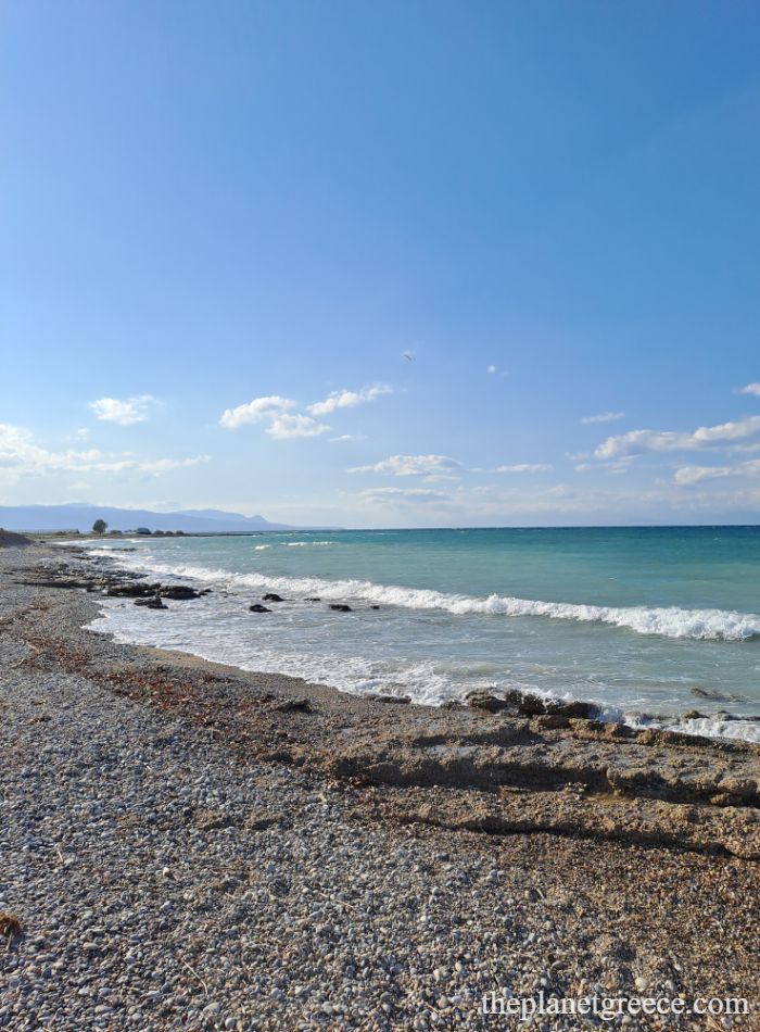 View of the pebbled beach and turquoise sea near the ancient port of Lechaion, close to Acrocorinth.