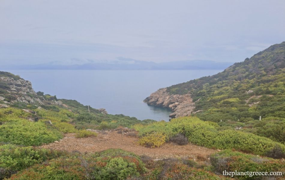 Panoramic view of cliffs and deep blue sea near Melagkavi Lighthouse in Loutraki, Greece.